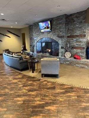 Comfortable lounge by the fire while you're waiting for your flight