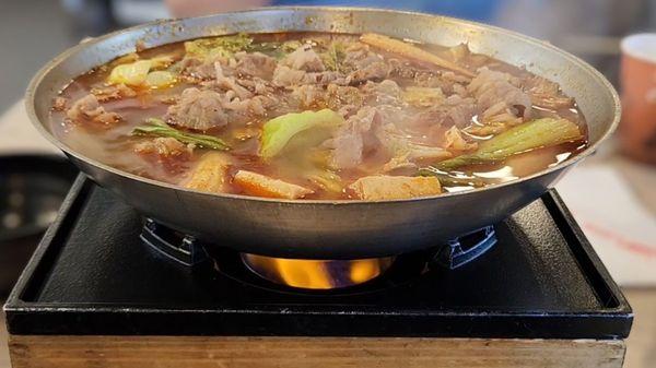 Build Your Own Hot Pot, Taiwanese Spicy broth, spicy (level 3). Hot pot is served over a flame.