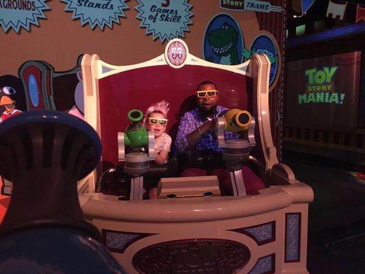 My daughter enjoys riding with the champ of the toy story ride