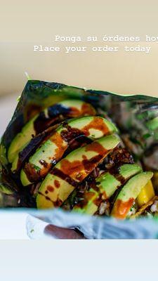 Aguachile-tosí Raw shrimp cooked in lime red onions cucumbers mango lime avocado chips