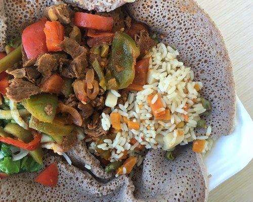 Beef Tibs, rice pilaf, salad, injera | $8.99 (The owner serves a different Ethiopian entree Monday - Friday.)