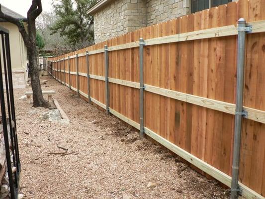 130 ft of cedar fence using galvanized steel posts, 3 rails and 3/4 inch pickets