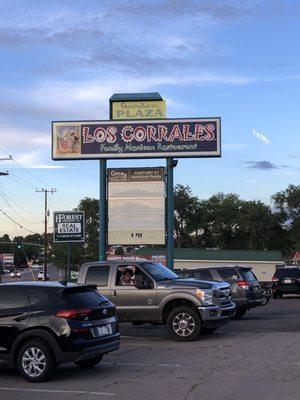 Exterior sign and part of parking lot