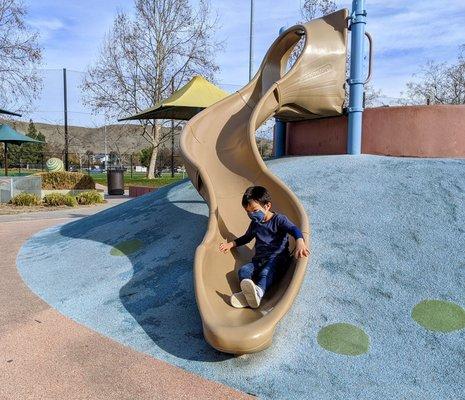 single slide with hilly terrain kids can climb