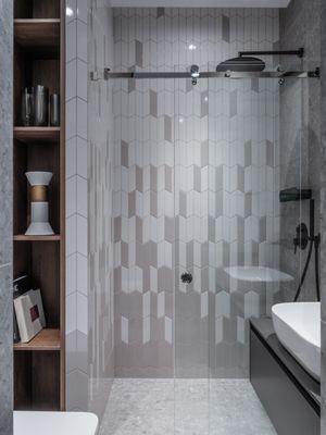 The bathroom is minimalistic and modern in style.