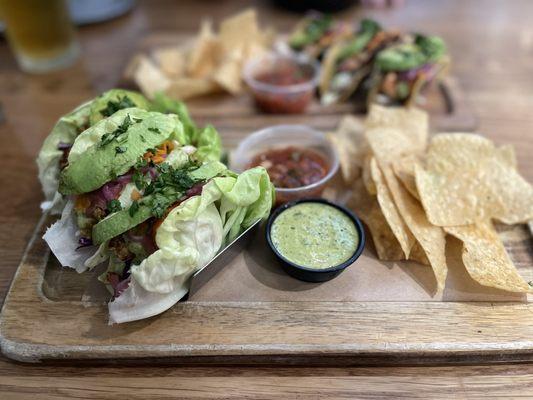 Lettuce wrapped Roasted Cauliflower Tacos and behind are the salmon tacos.