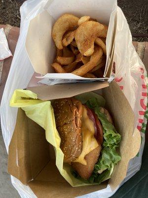 Fish filet sandwich with cheese, Cajun fries