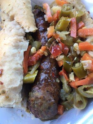 Italian sausage dipped with hot peppers. Look at how nicely this is presented. Not just slapped together and rolled in paper. Yum!