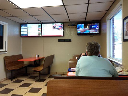 TV, rolling menu board, and them old timey booths up front