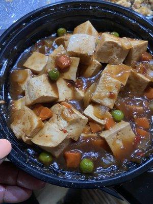 Looks like pot roast gravy with peas and carrots and not Szechuan tofu.  No flavor, no spice, just nasty