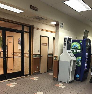 ATM and lottery. Entrance to Wendy's inside.