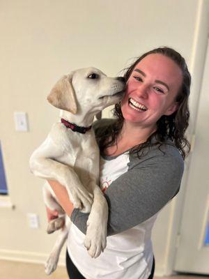 Head groomer, Caitlyn, and her pup Sully