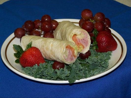 Try our luncheon wraps made on a platter with a couple of salads or in a boxed lunch.