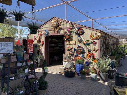 This building has vegetable seeds and plant food, etc.