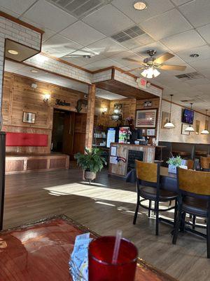 A photo of the counter area, and into the kitchen.