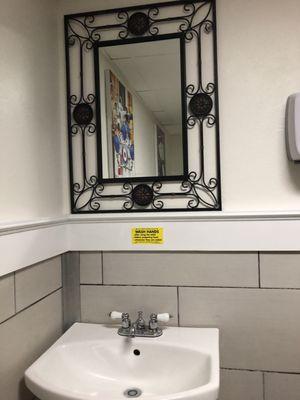 Bathroom with high mirror