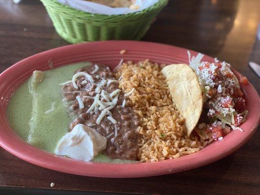 Cheese enchilada chicken taco combo. Delish homemade green sauce. It's not spicy, but it is a unique homemade sauce.