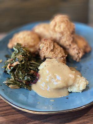 Fried Chicken with Greens and Brown Butter Mashed Potatoes.  These potatoes had chicken gravy on them.