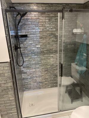 Tiled shower and glass shower door