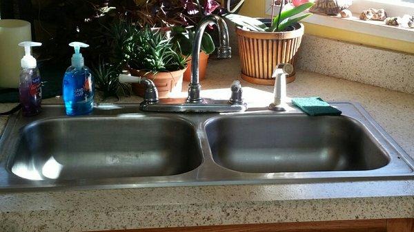 Old sink and faucet. Need Plumbing, Call us!