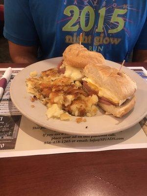 Breakfast sandwich with pork roll, side of hash browns. Perfectly prepared