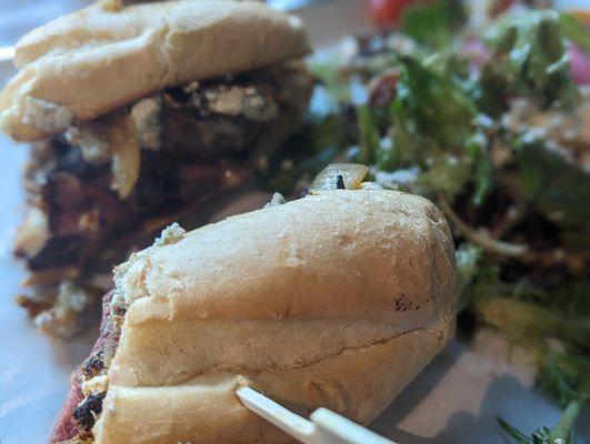 Steak sandwich with a side salad