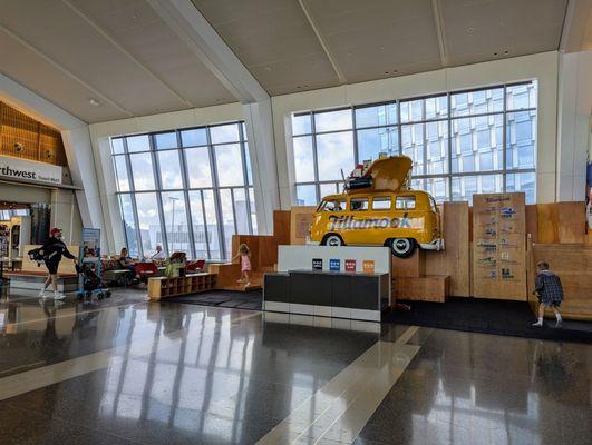 Tillamook van and kids playground and slide at Concourse E at PDX.