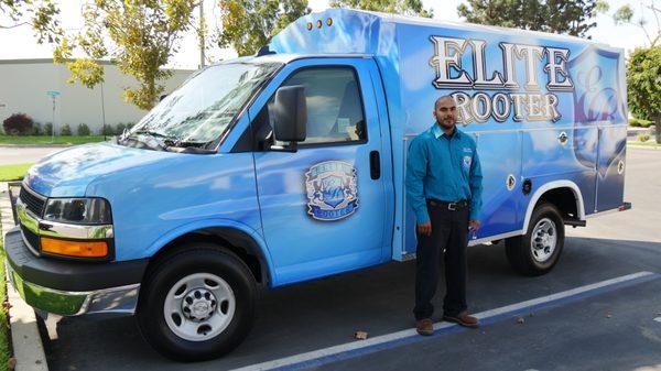 Elite Rooter technician standing by the service van, ready to provide expert plumbing solutions with a commitment to excellence.