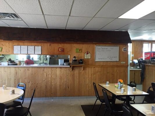 Kitchen area is made to look like a wooden hut.