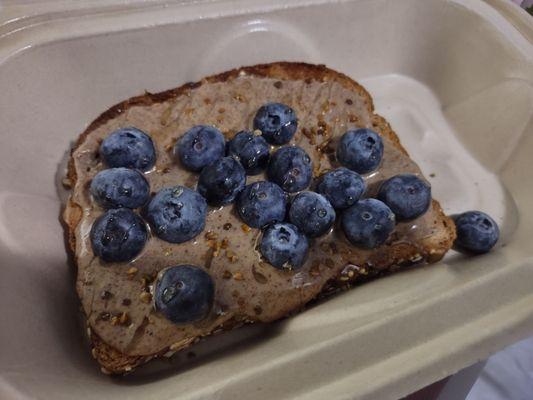 Almond butter toast with blueberries and honey! Yum!