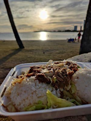 Kalua Pig and cabbage with rice... During sunset at Ala Moana Beach!