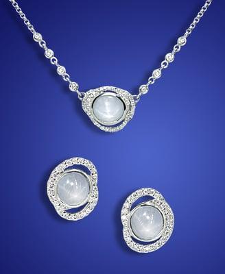 Pale grey star sapphires set into earrings and a pendant from Eve's "Interchange" series.