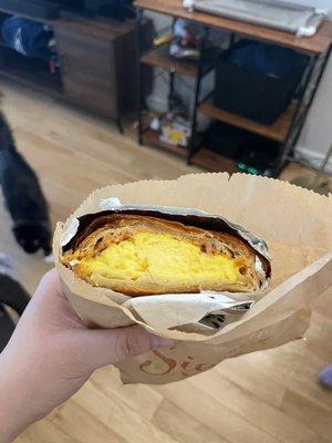 Bacon egg and cheese on croissant