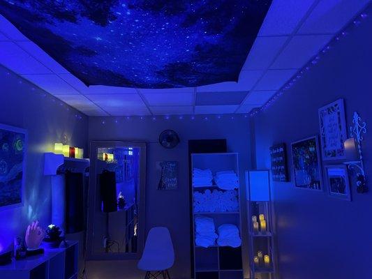 The Fish Tank Treatment Room, is the coolest massage room out there. It's like being in a fish tank where everything glows under UV lights.