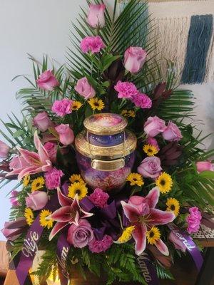 The arrangement for my mom's urn. It has 50 flowers and a touch of gold in it to signify the 50 years she and my step-dad were married.