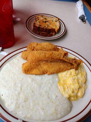 Catfish and grits with eggs scrambled soft and raisin toast