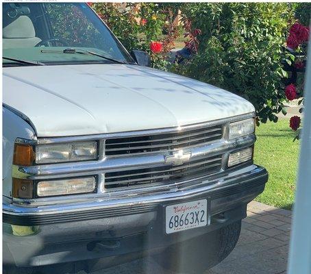 Angel's White 1998 Chevy Truck with License Plate.