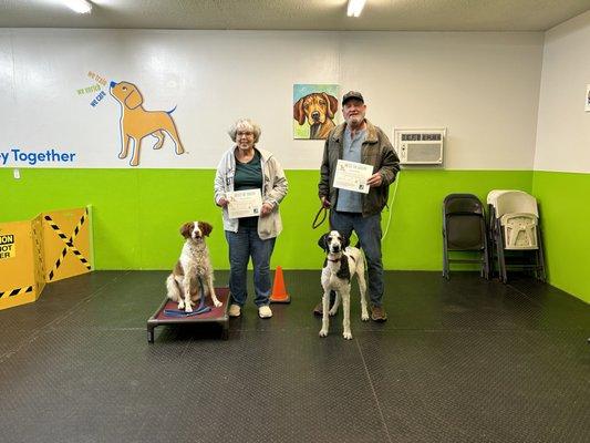 Dog training class graduates