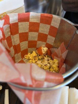 Popcorn brought to table to snack on while waiting for food!