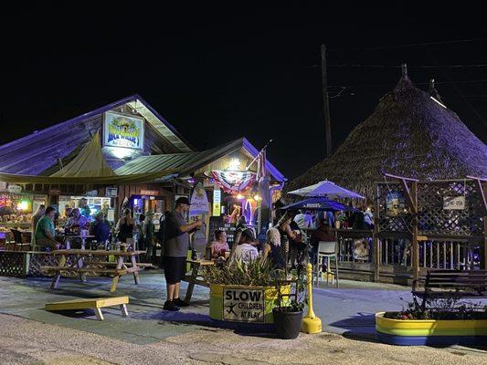 Tiki, outside seating, cornhole