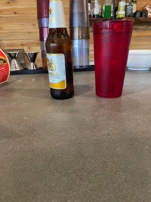 Singh a beer at the bar with water.