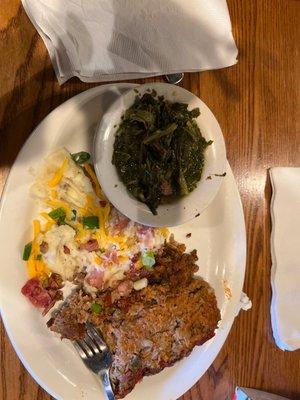 Meatloaf with loaded mashed potato with greens.