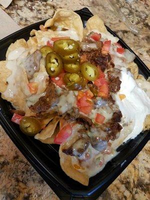 Del Taco's Queso Nachos (used to be called Macho Nachos).. White cheese just doesn't cut it, bring back the gooey orange nacho cheese!