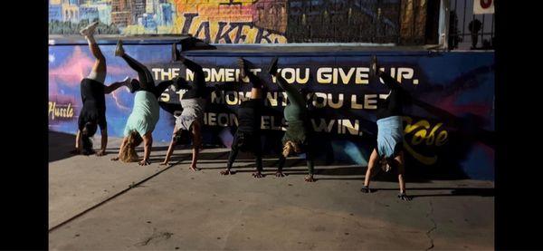 Crazy ladies doing head stands!