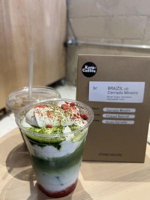 Strawberry Matcha with coffee beans to go