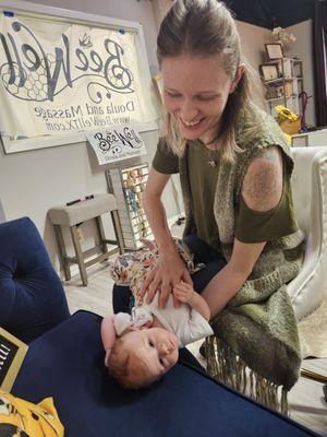 This is how she ended her 20 min infant massage, smiling at mom. While looking the direction that she didnt seem to like when we started.