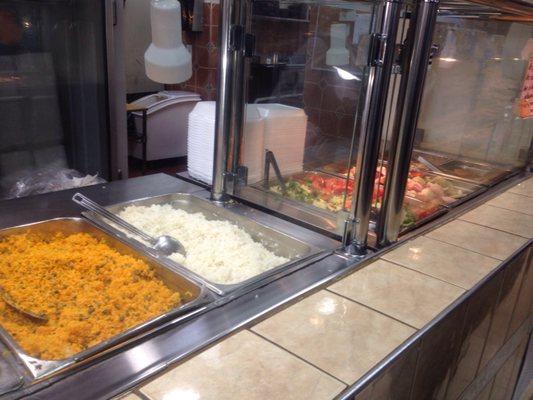 The beginning of their prepared foods counter. Just go up and tell them what you'd like. Plates or individual items.