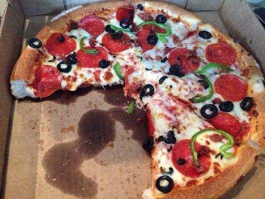 A build-your-own pizza with pepperoni, green pepper, bacon, and black olives.