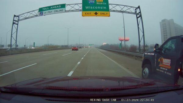 Driver aggressively passing on shoulder