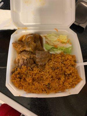 Yellow rice with pigeon peas and 3 pieces of oxtail.